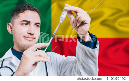 Doctor holding syringe on Benin flag background. Medical professional holding syringe with Beninese flag in the background Doctor holding syringe on Benin flag background. Medical professional holding syringe with Beninese flag in the background 140199492