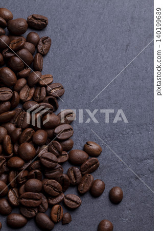 Roasted coffee beans on granite background Roasted coffee beans on granite background 140199689