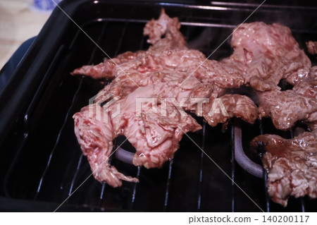 Grilling Raw Meat on a Grill Grilling Raw Meat on a Grill 140200117