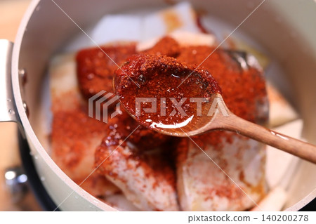 Spiced Meat in Pot with Wooden Spoon Spiced Meat in Pot with Wooden Spoon 140200278