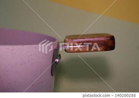 Close-up of Purple Pot with Wooden Handle Close-up of Purple Pot with Wooden Handle 140200288