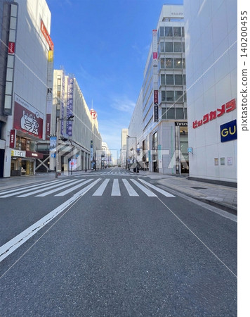 The deserted Shinjuku pedestrian zone and the Tokyo skyline with its cluster of skyscrapers. The deserted Shinjuku pedestrian zone and the Tokyo skyline with its cluster of skyscrapers. 140200455