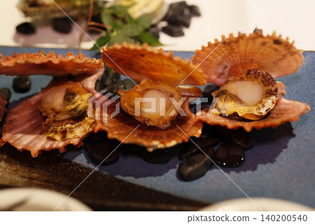 Fresh Scallops in Shells on a Plate Fresh Scallops in Shells on a Plate 140200540