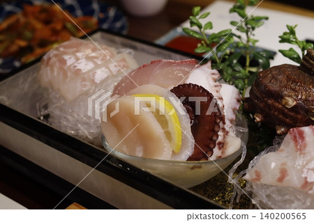 Fresh Seafood Sashimi Platter with Garnishes Fresh Seafood Sashimi Platter with Garnishes 140200565