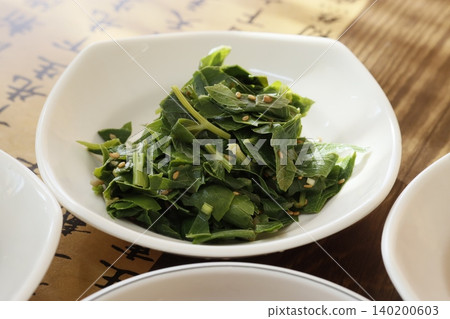 Fresh Green Leaf Salad with Sesame Seeds in White Bowl Fresh Green Leaf Salad with Sesame Seeds in White Bowl 140200603