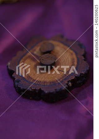 Wood Cross-Section with Growth Rings and Pegs on Purple Fabric 140200625