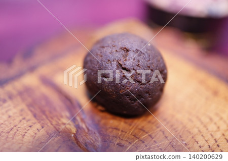 Dark Chocolate Cookie on Wooden Surface Dark Chocolate Cookie on Wooden Surface 140200629