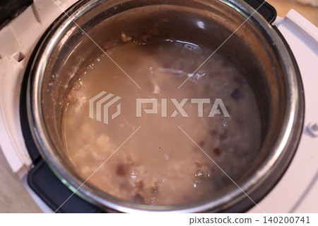 Slow Cooker with Porridge or Soup Inside 140200741
