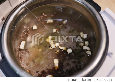 Cooking Pot with Rice and Aromatics Cooking Pot with Rice and Aromatics 140200744