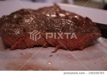 Juicy Medium-Rare Steak Close-Up Juicy Medium-Rare Steak Close-Up 140200765