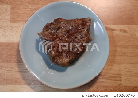 Grilled Steak on Blue Plate Grilled Steak on Blue Plate 140200770