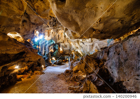 a cave with stalagmites and stalactites. a cave with stalagmites and stalactites. 140200946