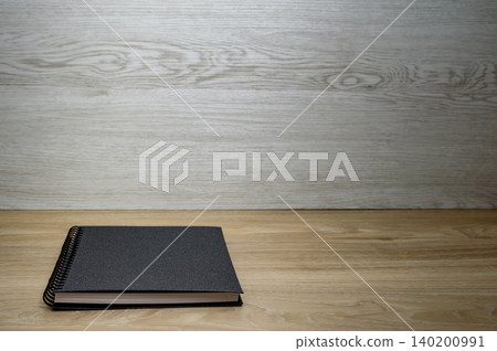 notebook on table notebook on table 140200991