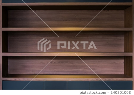 empty space of built in wooden shelf at wall with down-light empty space of built in wooden shelf at wall with down-light 140201008