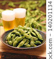 Black edamame and a glass of draft beer 140201134