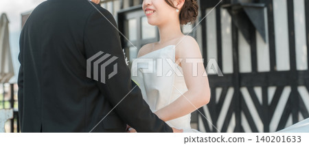 Bride and groom, couple taking wedding photos Bride and groom, couple taking wedding photos 140201633