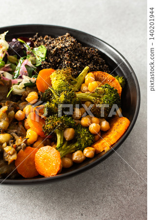 A wholesome breakfast of black quinoa, avocado, baked chicken, roasted vegetables like sweet potato, zucchini, and broccoli, along with a fresh salad of cabbage, radish, and chia seeds A wholesome breakfast of black quinoa, avocado, baked chicken, roasted vegetables like sweet potato, zucchini, and broccoli, along with a fresh salad of cabbage, radish, and chia seeds 140201944