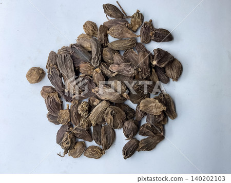 Pile of Dried Black Cardamom Pods, Whole black cardamom (Amomum subulatum) seed pods, an aromatic Indian spice Pile of Dried Black Cardamom Pods, Whole black cardamom (Amomum subulatum) seed pods, an aromatic Indian spice 140202103