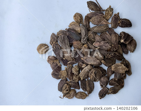 Pile of Dried Black Cardamom Pods, Whole black cardamom (Amomum subulatum) seed pods, an aromatic Indian spice Pile of Dried Black Cardamom Pods, Whole black cardamom (Amomum subulatum) seed pods, an aromatic Indian spice 140202106