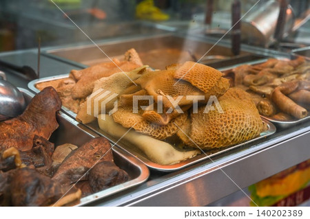 Traditional Cantonese stewed beef offal with honeycomb tripe at local street food stall on famous Rua do Cunha pedestrian street in Taipa Macau Traditional Cantonese stewed beef offal with honeycomb tripe at local street food stall on famous Rua do Cunha pedestrian street in Taipa Macau 140202389