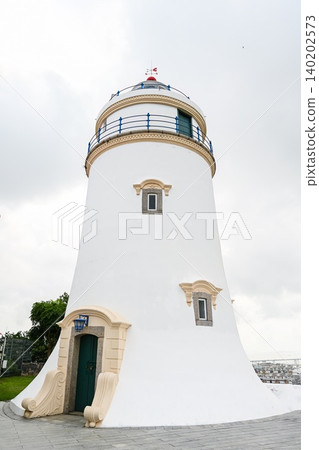 White facade architecture of historic heritage Guia Lighthouse building built in 1865 on Guia Hill in Macau China White facade architecture of historic heritage Guia Lighthouse building built in 1865 on Guia Hill in Macau China 140202573