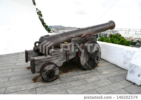 Ancient cannon on wooden wheels display at historic heritage Guia Fortress built in 1622 on Guia Hill in Macau China Ancient cannon on wooden wheels display at historic heritage Guia Fortress built in 1622 on Guia Hill in Macau China 140202574