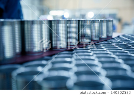 Rows of empty aluminum cans stacked in food processing factory Rows of empty aluminum cans stacked in food processing factory 140202583