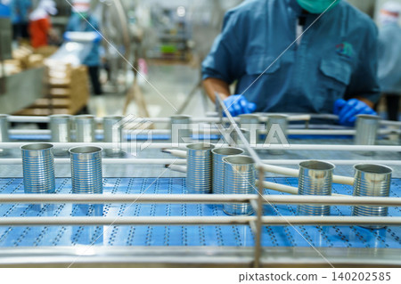 Rows of empty aluminum cans stacked in food processing factory Rows of empty aluminum cans stacked in food processing factory 140202585