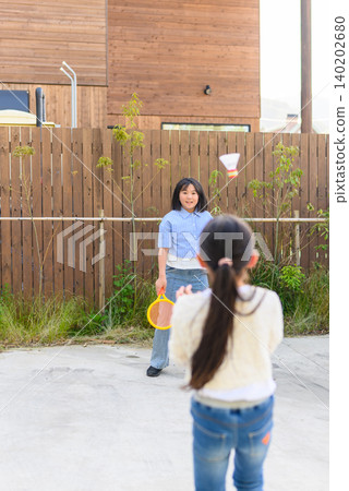 Children playing badminton Children playing badminton 140202680