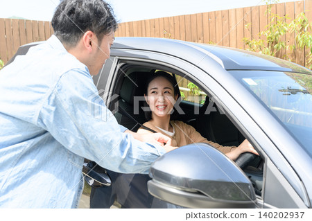 A woman smiling inside a car A woman smiling inside a car 140202937