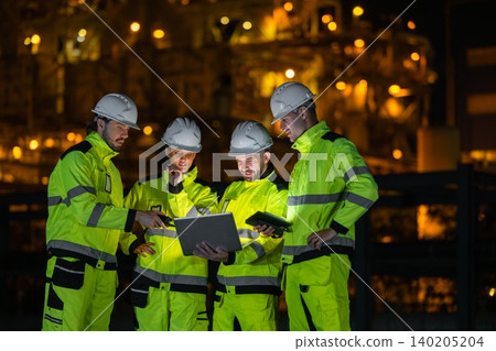 Group of Petroleum Professional Engineer Team Working against Oil Gas Refinery Offshore Construction 140205204