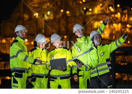 Group of Petroleum Professional Engineer Team Working against Oil Gas Refinery Offshore Construction Group of Petroleum Professional Engineer Team Working against Oil Gas Refinery Offshore Construction 140205225