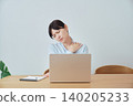 Women experiencing shoulder stiffness while working from home 140205233