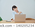Women experiencing shoulder stiffness while working from home 140205234