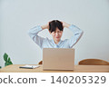 A woman struggling with her work-from-home situation. 140205329