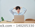 A woman struggling with her work-from-home situation. 140205330