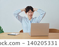A woman is troubled by work-related problems. 140205331