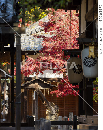 A beautiful view of a shrine with autumn leaves. A beautiful view of a shrine with autumn leaves. 140205472