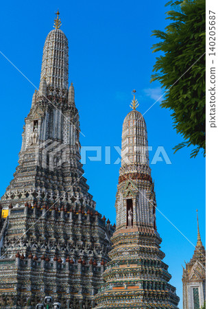 Wat arun temple dawn bangkok chao phraya river tower spire under blue sky with ornate calm historic architecture Wat arun temple dawn bangkok chao phraya river tower spire under blue sky with ornate calm historic architecture 140205687