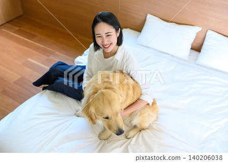 woman hugging a dog 140206038