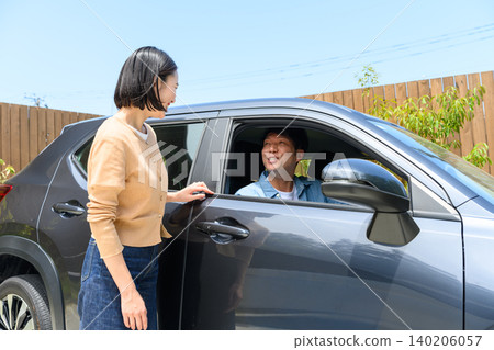 A young man and woman talking in a car A young man and woman talking in a car 140206057