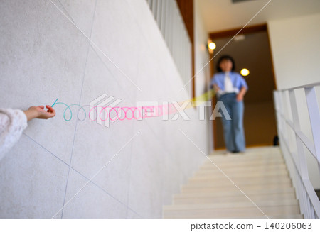 A woman playing on the stairs A woman playing on the stairs 140206063
