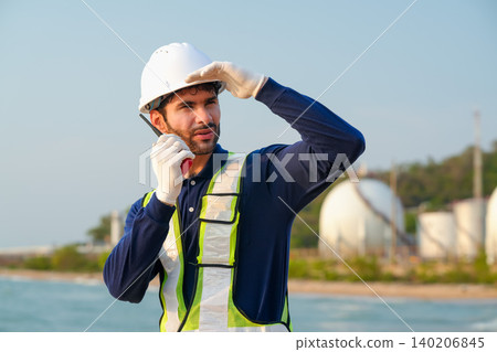 Safety protocols in industrial operations coastal area image of worker daylight close-up professionalism and preparedness Safety protocols in industrial operations coastal area image of worker daylight close-up professionalism and preparedness 140206845