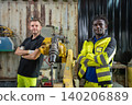 Industrial workers collaborate in modern factory high-tech environment professional photography 140206889