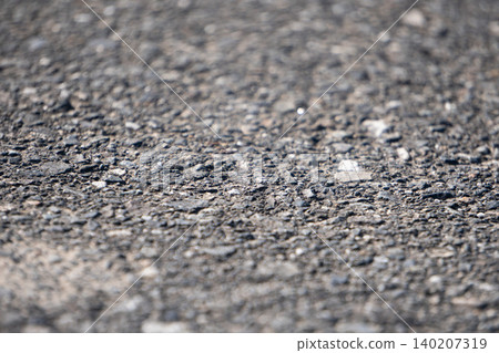 Close-up of the rough texture of asphalt Close-up of the rough texture of asphalt 140207319