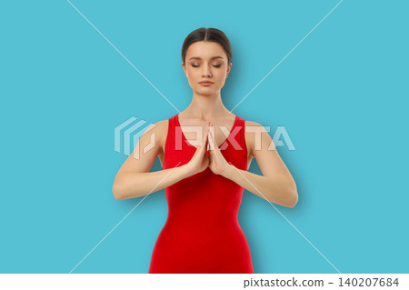 Yoga session indoors with person practicing mindfulness Yoga session indoors with person practicing mindfulness 140207684