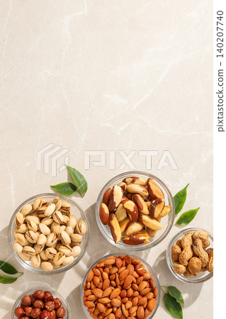 Nuts and seeds in bowls on a kitchen counter Nuts and seeds in bowls on a kitchen counter 140207740