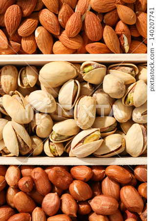 Nuts are shown in containers with different types present Nuts are shown in containers with different types present 140207741