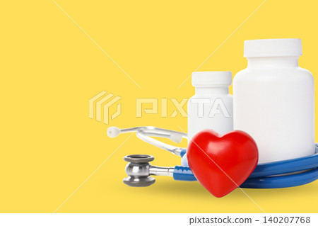 Pill bottles and a stethoscope are arranged with a heart symbol Pill bottles and a stethoscope are arranged with a heart symbol 140207768