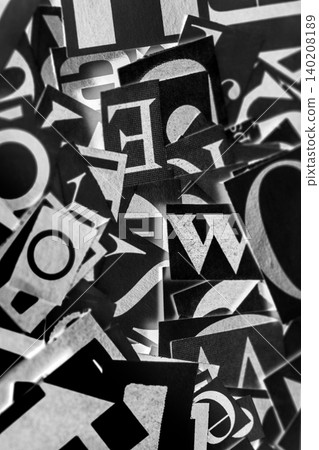 Pile of many black and white letters from newspapers and magazines. Typography background composition. Pile of many black and white letters from newspapers and magazines. Typography background composition. 140208189